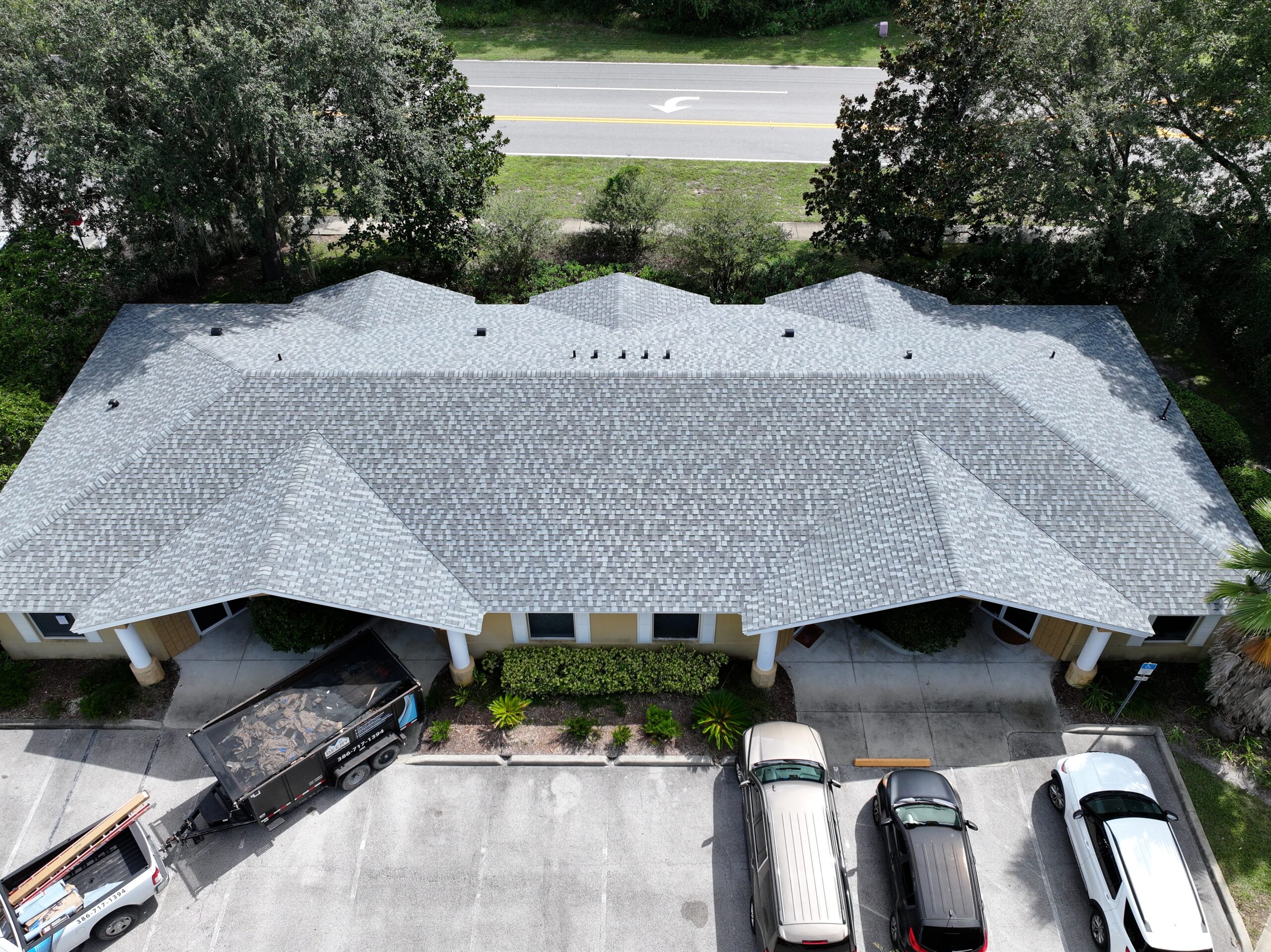 Aerial view of a completed commercial shingle roof installed by Beery Roofing & Redesign